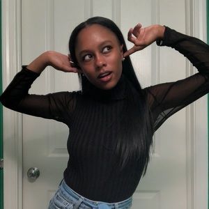 black sleeveless turtleneck.